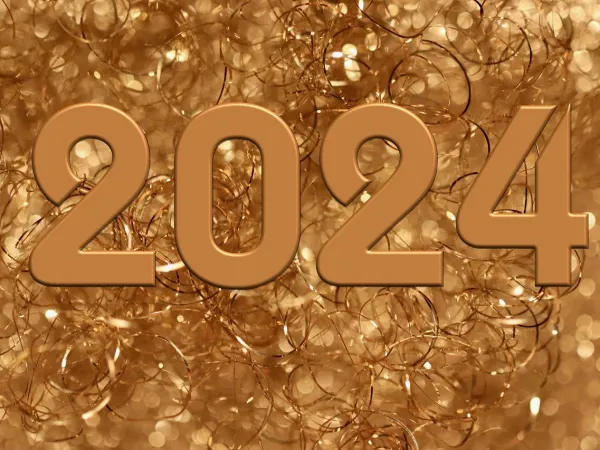 Blick auf eine goldene Zahl (2024) vor goldenem Schmuckhintergrund